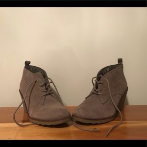 Grey booties with heels.